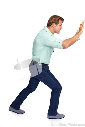 Image of Man, pushing and obstacle or frame in struggle against a white studio background. Isolated casual male walking to push heavy weight or shield using physical effort with expression or gesture