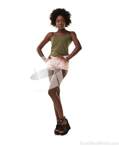 Image of Fashion, casual and portrait of an African model in a studio with a trendy, edgy and cool outfit. Beauty, young and black woman with an afro wearing stylish clothes while isolated by white background