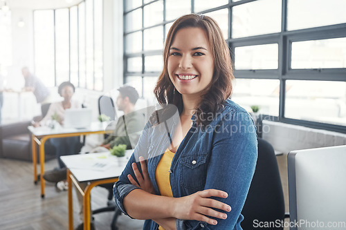 Image of Creative business woman, leader and arms crossed with smile for management, career or vision at the office. Portrait of a young designer standing and smiling in happiness for job, goals or startup