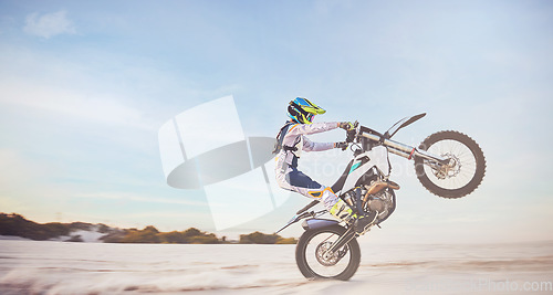 Image of Motorbike, motorcycle athlete and desert drive with mockup cycling in nature for sport adventure. Jump, freedom and sports driving training of a man with speed on sand trail for fitness and exercise