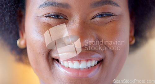 Image of Confident and proud black woman smiling, showing strength and dignity. Closeup of the face and head of a beautiful young african american female showing her teeth with a big smile and feeling happy