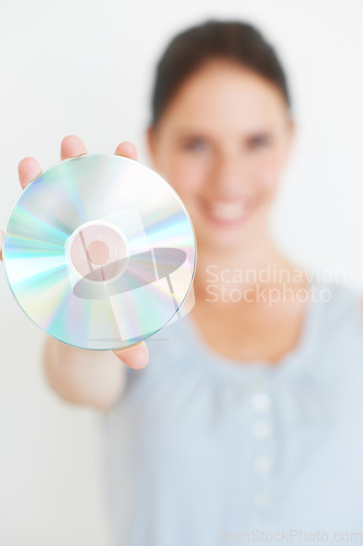 Image of Vintage, music and hand of woman with cd in studio showing nostalgic, fun and old fashioned entertainment with mockup. Hands, dvd and girl presenting shiny disc, copy space and isolated mock up