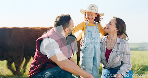 Image of Family, farm and agriculture with a girl, mother and father on a field or meadow of grass with cattle. Sustainability, love and children with a man, woman and daughter on a farmer ranch together