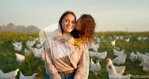 Image of Hug, child and mother on a farm with chicken on mothers day, travel or holiday in Argentina together. Happy, portrait and kiss from girl with her mama on a field with animals during vacation