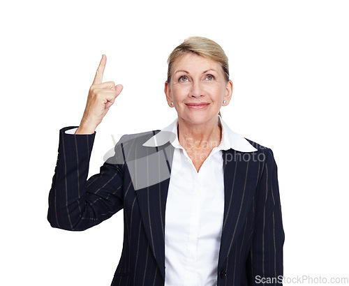 Image of Senior business woman, smile and pointing finger up in white background for suggestions, product placement and mockup. Elderly person, happy face and corporate manager hand gesture isolated in studio