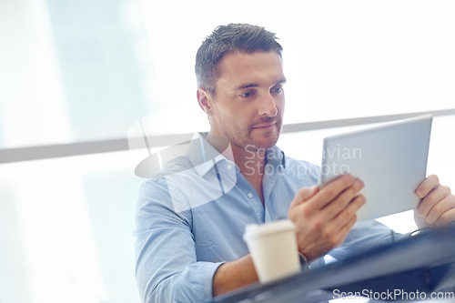 Image of Corporate, thinking or businessman with tablet in airport lobby for communication, networking or news blog read. Focus, travel or manager with tech for social media app, social network or web search