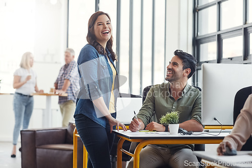 Image of Woman, businessman and funny conversation at startup office, desk and friends at web design company. Creative leader, man and modern office with comic, happy talk and team building at job in New York