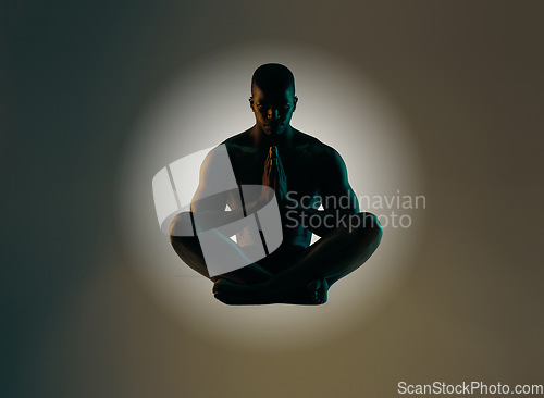 Image of Meditation art, silhouette or relax man meditate for spiritual mental health, chakra energy balance or soul healing. Zen mindset peace, mindfulness or shadow model float isolated on studio background