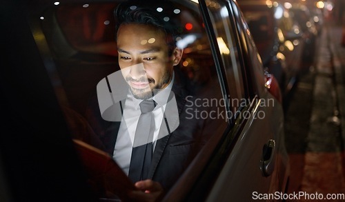 Image of Travel, tablet and business man in car on social media, internet browsing or working. Transport, night and young male professional with digital technology for networking, web scrolling or research.