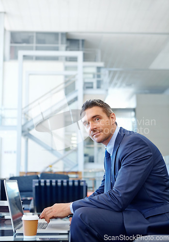 Image of Portrait, corporate or business man with laptop for invest strategy, finance growth or financial review. Coffee, airport or manager in lobby on sofa for travel, data analysis or economy data research
