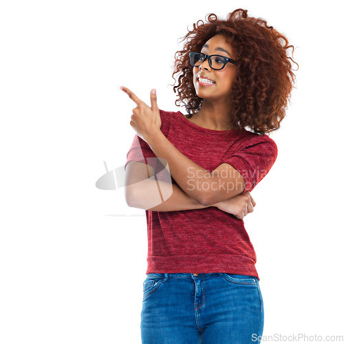 Image of Black woman, pointing finger and studio with smile, beauty and casual clothes by white background. Woman, isolated model and hand sign with fashion, jeans and glasses on face with natural afro hair