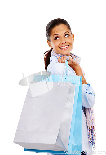 Image of Woman, shopping bags and smile for fashion sale, discount or deal against white studio background. Happy isolated female shopper smiling holding gift bag for retail shopping spree on white background