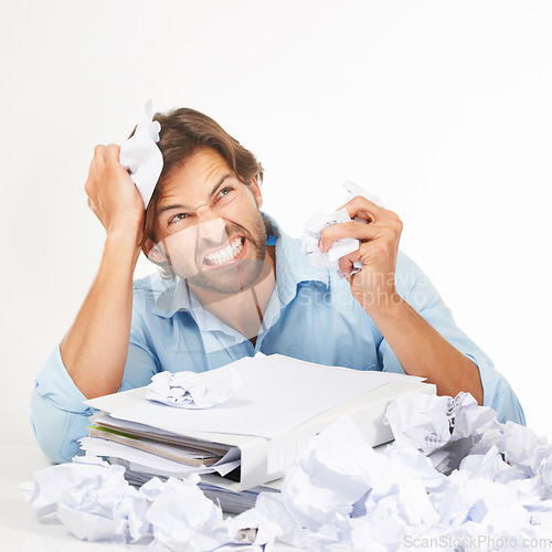 Image of Business, paper and man angry, stress and frustrated with mental health, documents and employee isolated on white studio background. Writer, paperwork and worker upset, annoyed with work and burnout