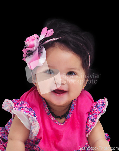 Image of Portrait, baby and girl with a newborn infant in studio on a black background in floral clothes. Kids, flower and development with a female child on dark space for cute or adorable product placement