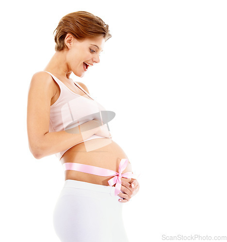 Image of Pregnant, woman and ribbon around stomach in studio happy, smile and excited for motherhood. Pregnancy, bow and girl touching her belly, cheerful for fertility, wellness and white background mockup