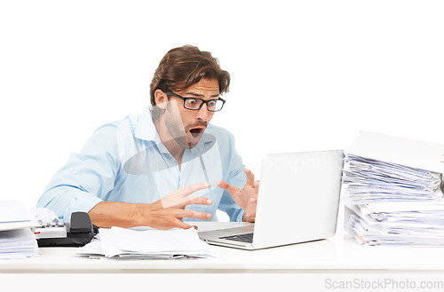 Image of Laptop, paperwork and businessman with shock after reading information online in studio. Shocked, surprise and professional male employee with wtf or omg facial expression with computer and documents