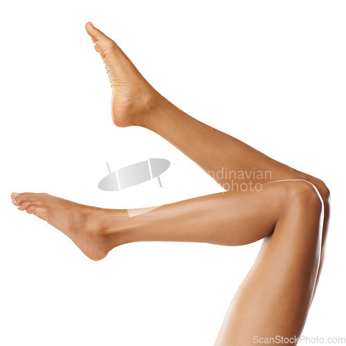 Image of Skincare, spa and legs of woman on a white background for shaving, grooming and pedicure wellness. Cleaning, beauty and feet of girl isolated in studio for laser treatment, cosmetics and hair removal