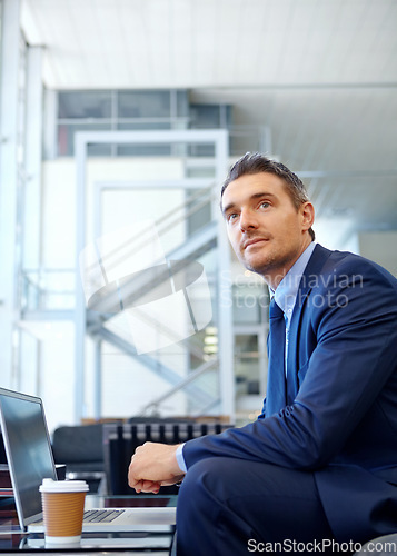 Image of Thinking, corporate or businessman with laptop for invest strategy, finance growth or financial review. Coffee, focus or manager in airport sofa for travel, data analysis or economy data research