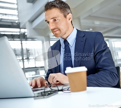 Image of Laptop, office and businessman working on a report or corporate proposal for the company. Success, technology and professional male employee from Canada doing research for a project in the workplace.