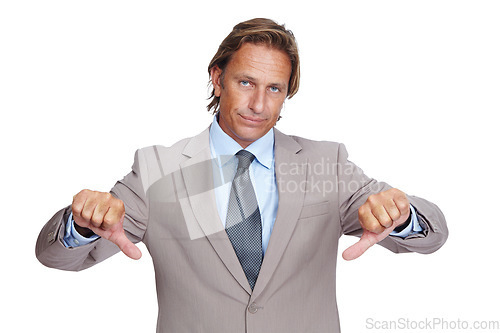 Image of Businessman, thumbs down and upset in disappointment for failure against a white studio background. Portrait of a isolated business man pointing down thumbs in disapproval, wrong or incorrect gesture