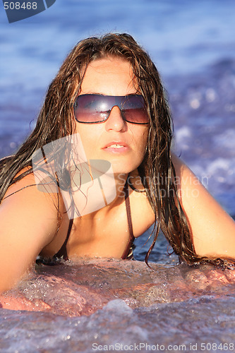 Image of Young woman at beach 