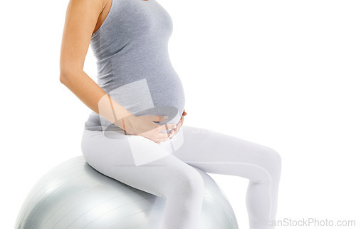 Image of Pregnant woman, stomach and exercise ball with white background for fitness, pilates and wellness. Pregnancy, medicine ball and workout in studio for healthy maternity, yoga training and body energy