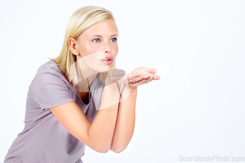 Image of Flirt, thinking and woman with air kiss contemplating, pondering and thoughtful for advertising. Attractive, flirting and affection of isolated model blowing kisses on white background mock up.