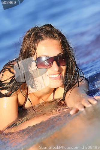 Image of Young woman at beach 