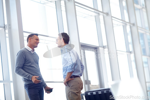 Image of Airport, lounge and partner communication of business people talking, networking and chat about airplane journey. Conversation, discussion or corporate employee, worker or agent speaking about travel