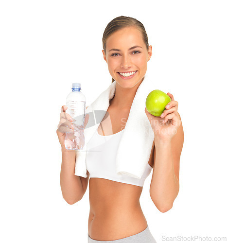 Image of Studio portrait, woman and water with apple, smile and nutrition for workout goal, health and white background. Isolated model, bottle and fruit diet for healthy training, wellness and strong body