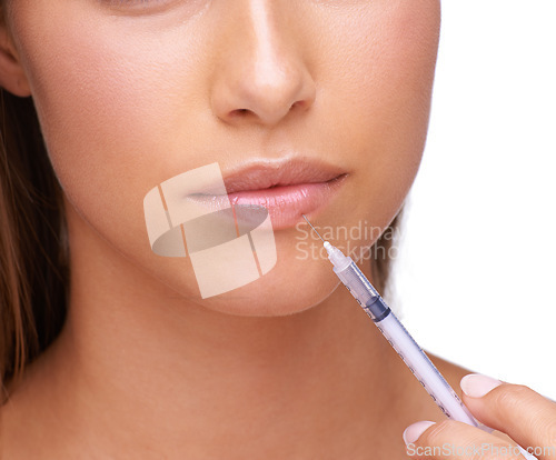 Image of Beauty, botox and woman with needle for lips isolated on white background for treatment, lip filler and injection. Cosmetics, makeup and face zoom of girl for plastic surgery, skincare and collagen