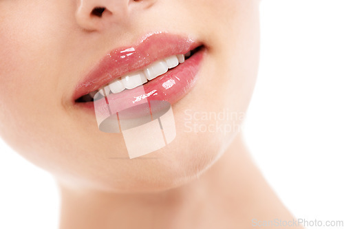 Image of Woman, face or skincare lips with makeup cosmetics, mouth dermatology and healthcare wellness on white background. Zoom, beauty model and happy smile with facial lip gloss product for hydration glow