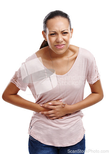 Image of Woman in a studio with stomach pain, injury or sickness from indigestion or constipation. Discomfort, uncomfortable and female model with a menstrual tummy ache or sore isolated by a white background