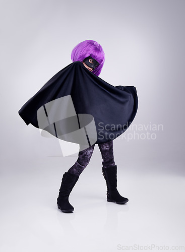 Image of Costume, girl and hero outfit for fantasy, party and kid isolated on white studio background. Cosplay, female child or young person in character for play, dress up and imagination with mask and cape