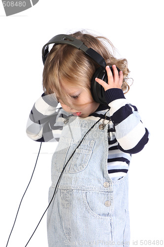 Image of beauty a little girl listening music 