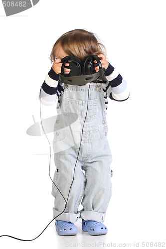 Image of beauty a little girl listening music 