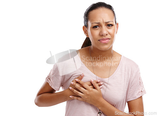 Image of Woman, breast and cancer holding chest in discomfort, pain or ache against a white studio background. Portrait of isolated young female clutching boobs touching painful area, sore or inflammation