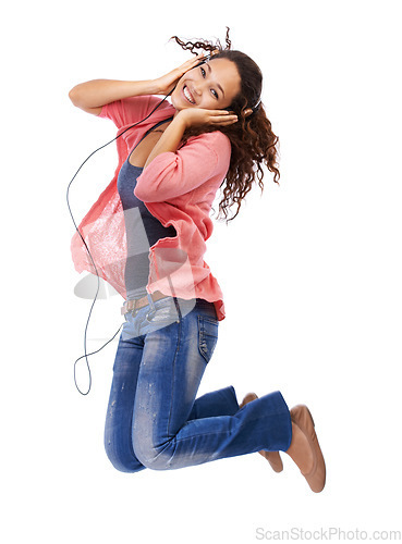 Image of Portrait, music headphones and woman jump in studio isolated on a white background mock up. Jumping, energy and happy female with hifi headset streaming, listening or enjoying podcast, radio or audio