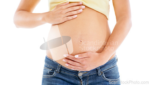 Image of Pregnant woman, stomach and hands with studio background for body, maternity wellness and healthcare. Closeup abdomen, beauty and pregnancy of mother for skincare, healthy life and white background