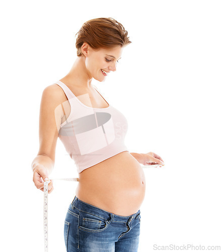 Image of Woman, pregnancy stomach and measuring tape for baby wellness, healthcare support and lifestyle motivation in white background studio. Mother, pregnancy and maternity wellbeing or measuring belly