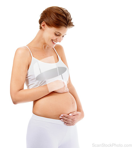 Image of Pregnancy love, smile and happy woman with stomach on a white background in studio. Happiness, care and pregnant woman smiling at her pregnant abdomen on a studio background with mockup space