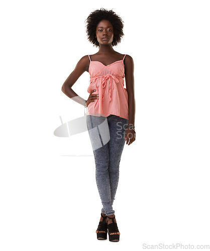 Image of Portrait, fashion and a black woman in studio on a white background with her hand on her hip in confidence. Clothes, trendy and confident with a young african american female posing for style