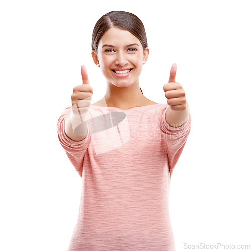 Image of Woman, smile and thumbs up for winner, sale or discount against a white studio background. Portrait of isolated young female showing thumbsup for good job, thank you or finished on white background