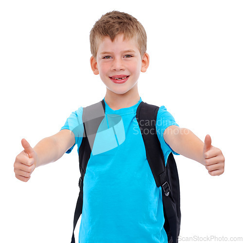 Image of Boy, portrait smile and thumbs up for school, education or learning against a white studio background. Young happy face of isolated casual child student with thumbsup, backpack or school bag