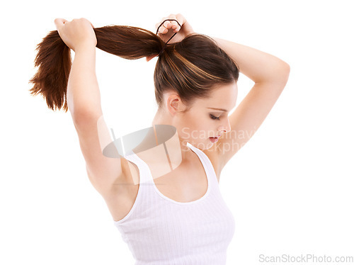 Image of Hair, beauty and mockup with a woman in studio isolated on a white background for natural or keratin treatment. Haircare, cosmetics and tying with a young female posing to promote her hairstyle
