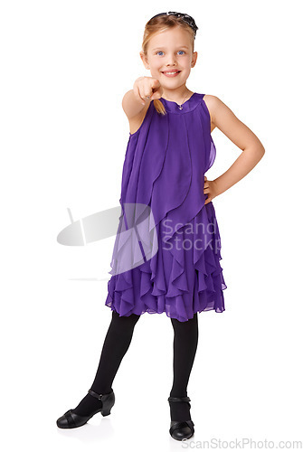 Image of Fashion, pointing and portrait of child on a white background for youth, glamour and ballroom dancing. Happy, dancer and isolated young girl pointing finger with stylish, beautiful and trendy dress