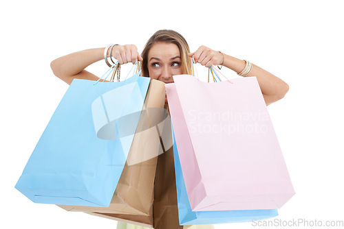 Image of Shopping, bags and retail with a woman customer in studio on a white background for a sale, discount or bargain deal. Brand, gift and product with a female consumer carrying shopping bags for sales