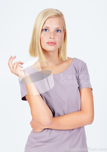 Image of Woman, portrait or attitude pose on studio background in assertive, serious or confidence facial expression. Model, body language or casual fashion clothes on white mockup backdrop on marketing space