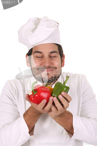 Image of chef smelling the aroma of peppers