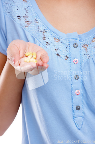 Image of Hand, medicine and pills with a woman in studio for healthcare, prescription medication or treatment. Tablet, medical and supplements with a female holding vitamins for nutrition, health or cure